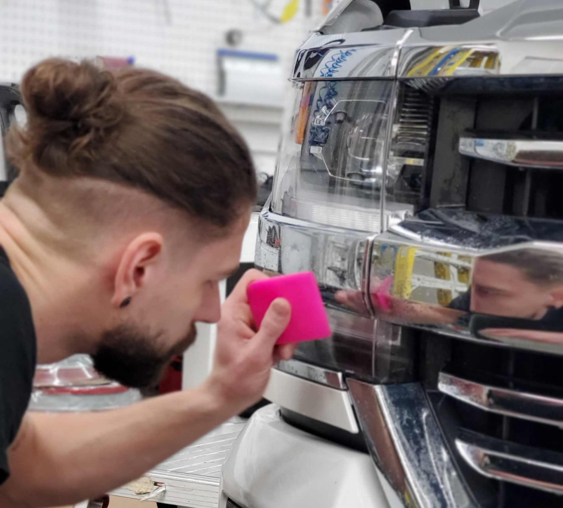 A member of the MIPP team demonstrating how to install Paint Protection Film